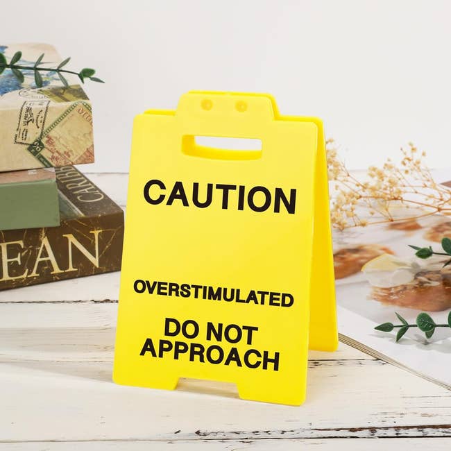 A yellow caution sign reads: