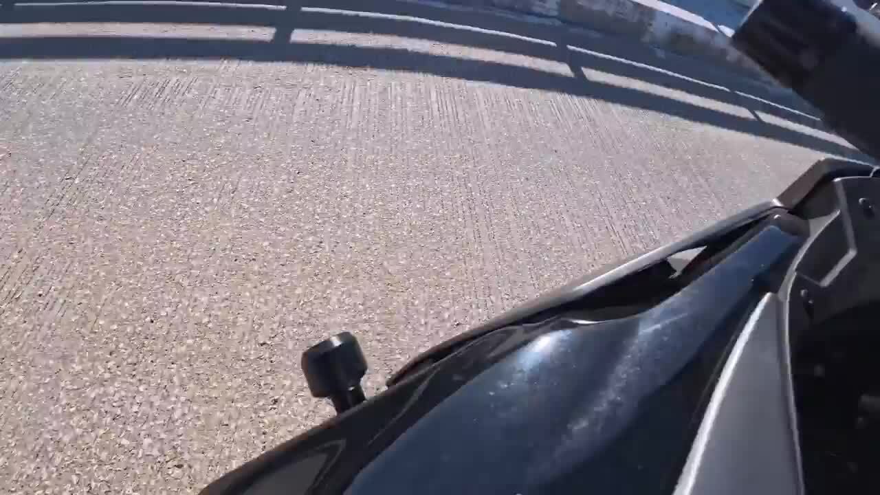 Person gets thrown off motorcycle while attempting wheelie