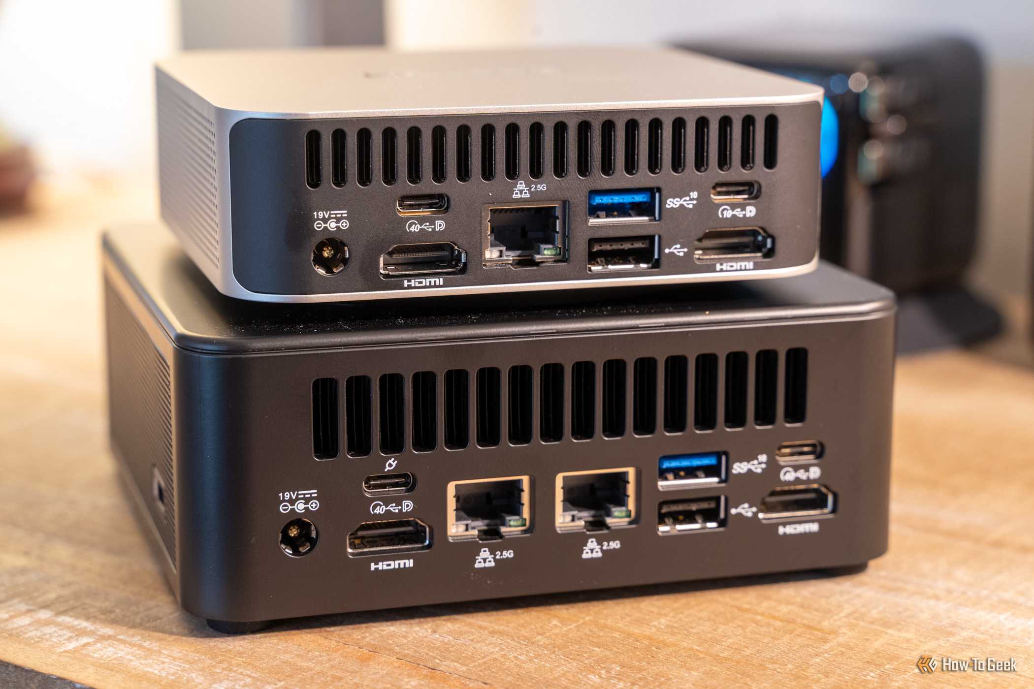 GEEKOM IT13 Max mini PC rear port and size comparison with smaller GEEKOM mini PC.