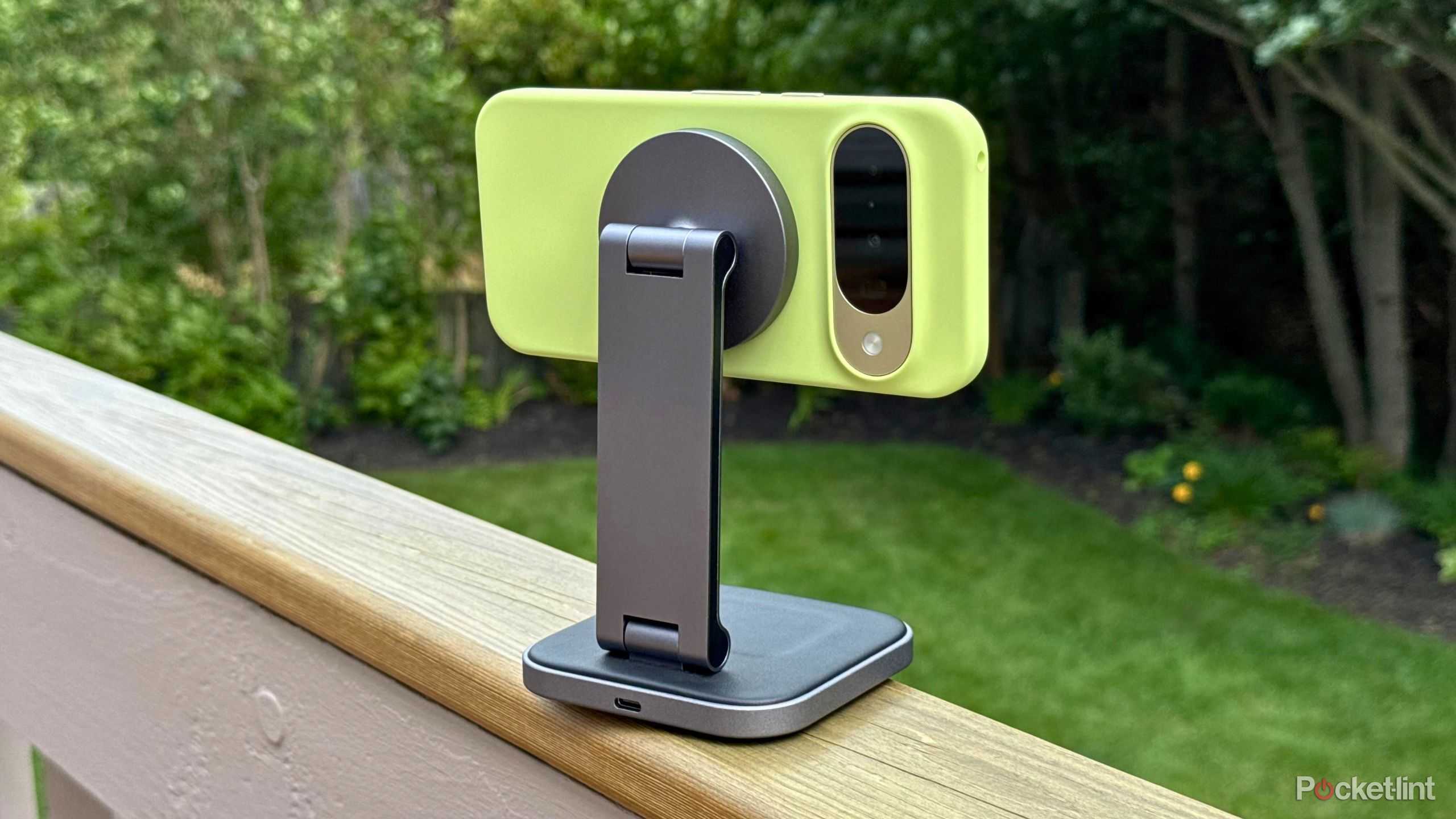 A Google Pixel 10 attached to a Satechi 2-in-1 Foldable Qi2 Wireless Charging Stand.
