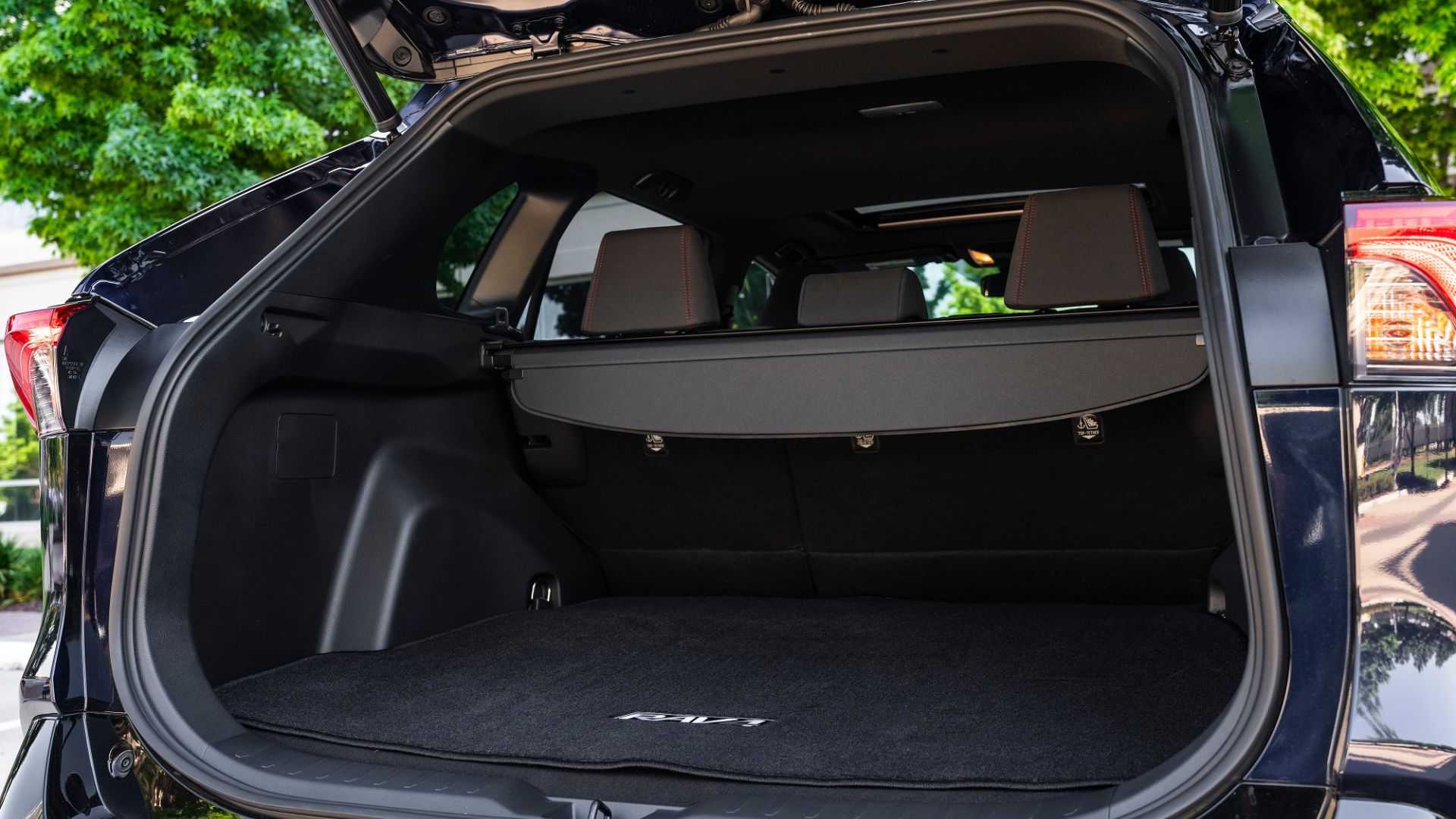 Close-up shot showing inside the trunk of a blue 2024 Toyota RAV4 Prime XSE.
