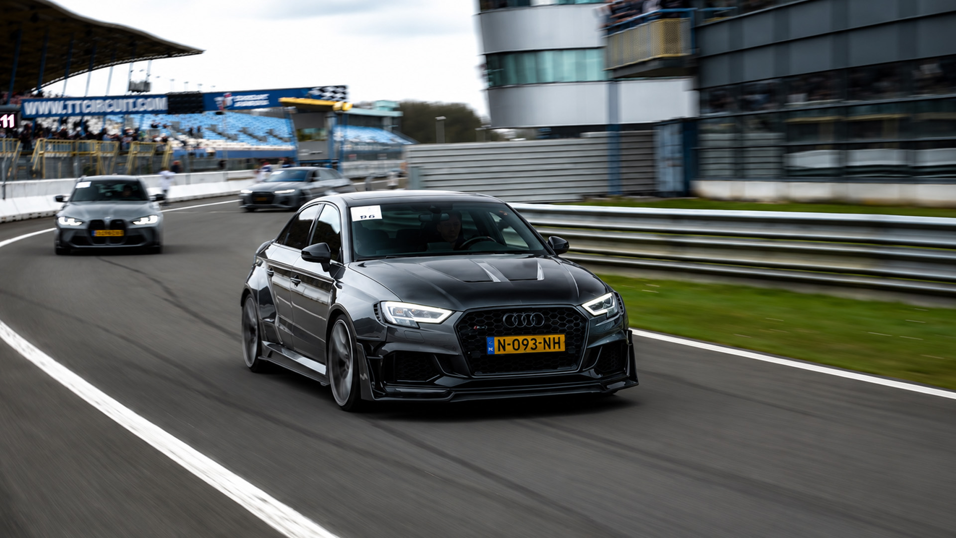 Modified Audi RS3 gets hunted by BMW on race track