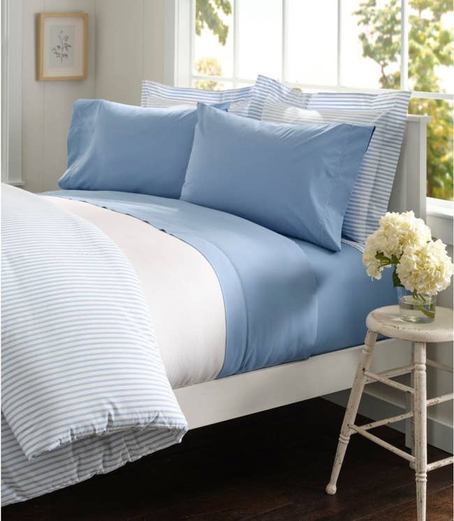 blue sheets placed on bed