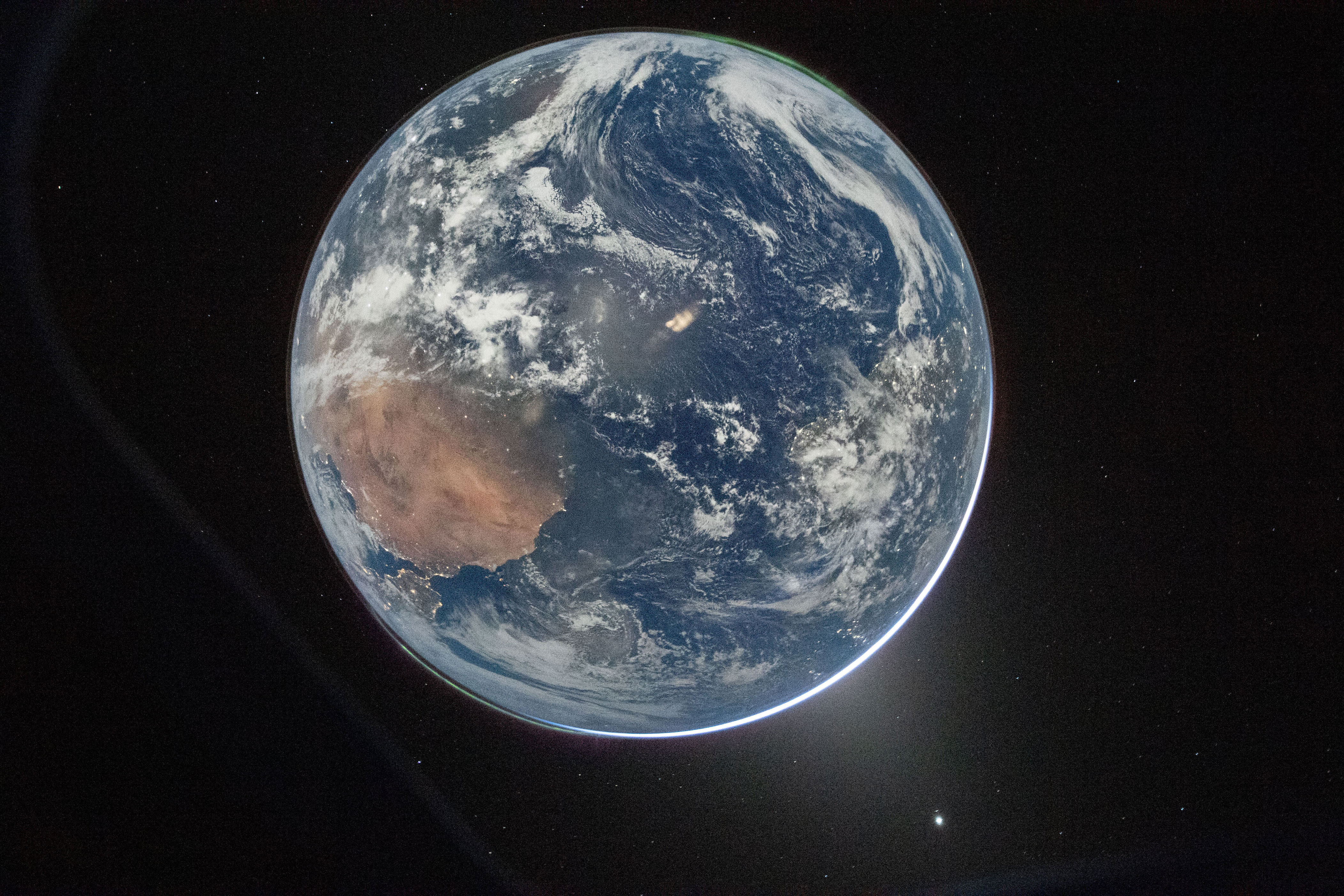 This image provided by NASA shows a view of Earth taken by NASA astronaut and Artemis II Commander Reid Wiseman from of the Orion spacecraft's window after completing the translunar injection burn on April 2, 2026. (NASA via AP) (Photo: via Associated Press)
