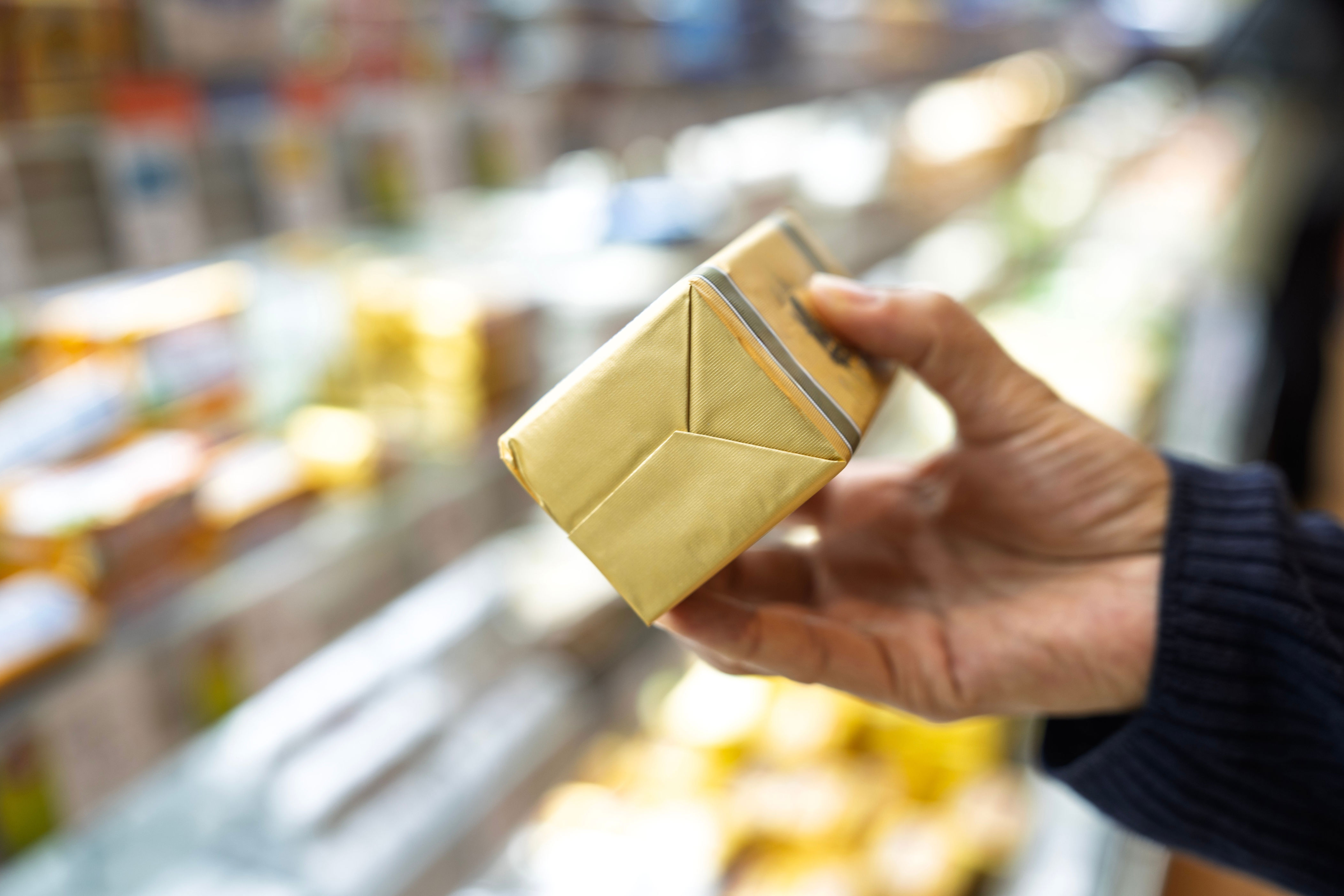A block of butter in gold wrapping