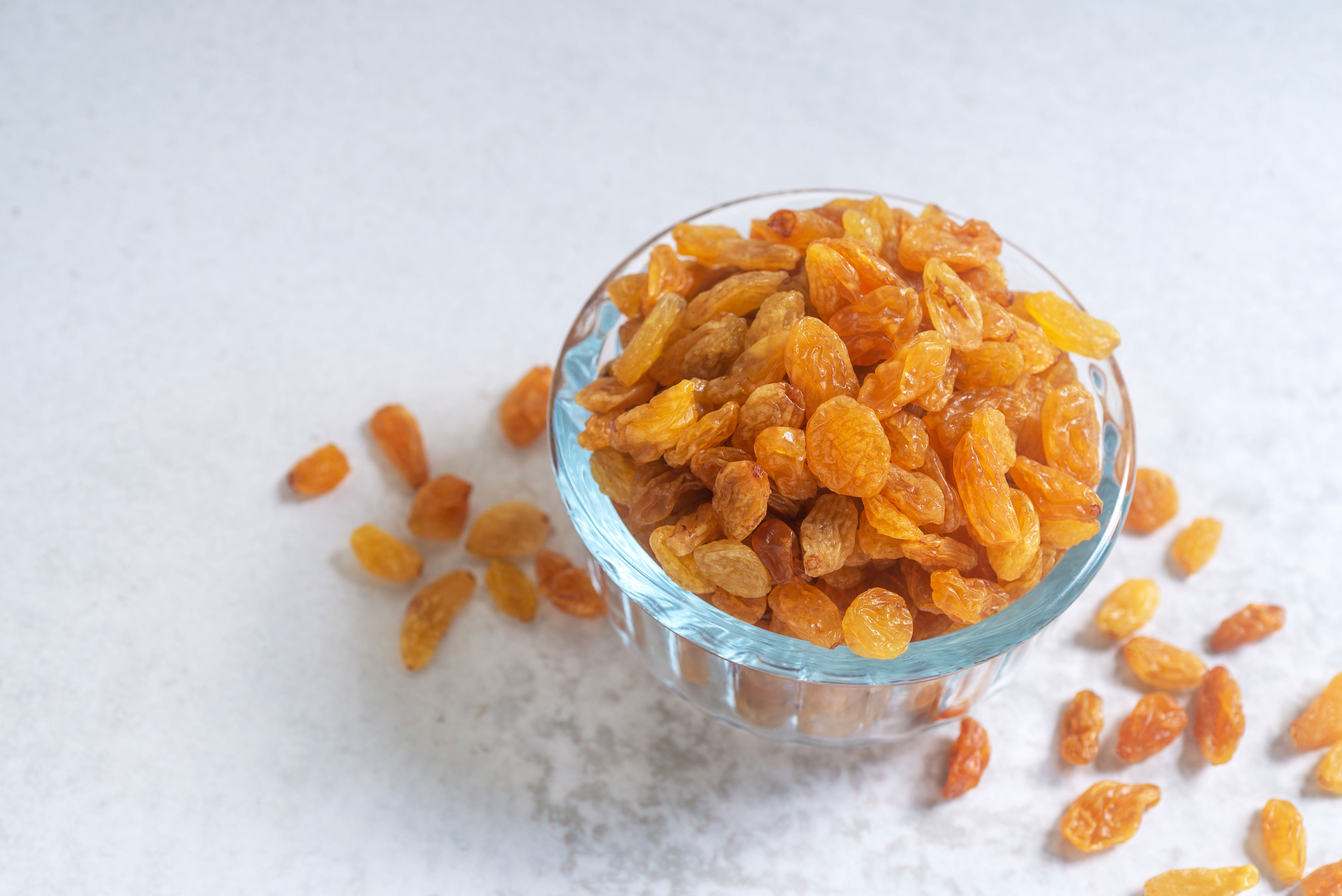 A bowl of golden raisins