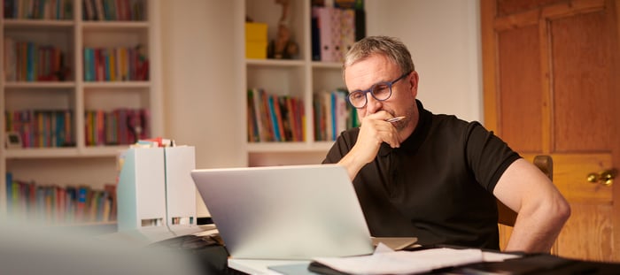 A person at a laptop.