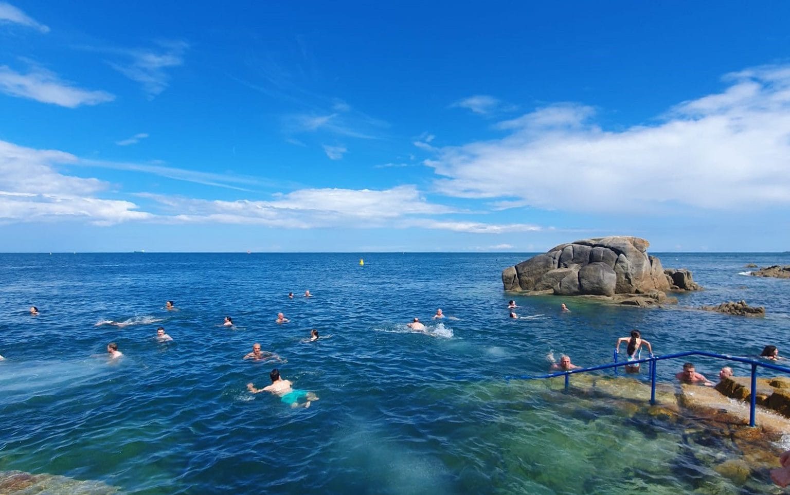 People swim in the Forty Foot, a local bathing spot in Haddington House