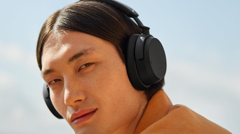 A person wearing the Sennheiser Accentum Wireless Headphones.