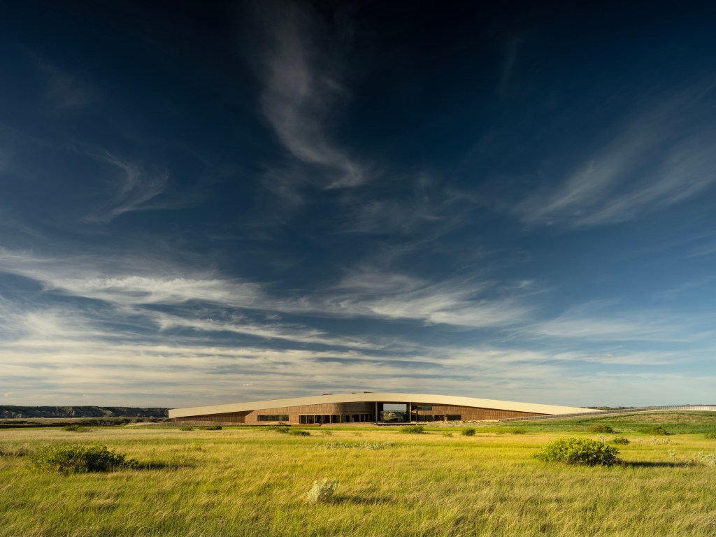 An overview of the Theodore Roosevelt Presidential Library set in the Badlands region of North Dakota.