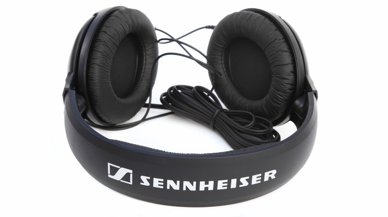 A pair of wired Sennheiser headphones against a white background.