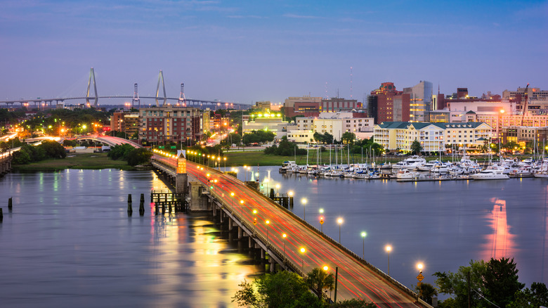Downtown Charleston, South Carolina skyline in the background with a bridge over the Ashley River in the foreground.
