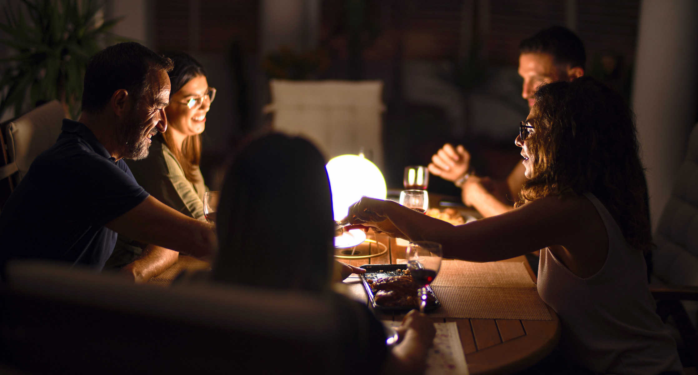 Phillips Hue lightbulb in a desk lamp. Night, Dinner, Family, Patio, Restaurant