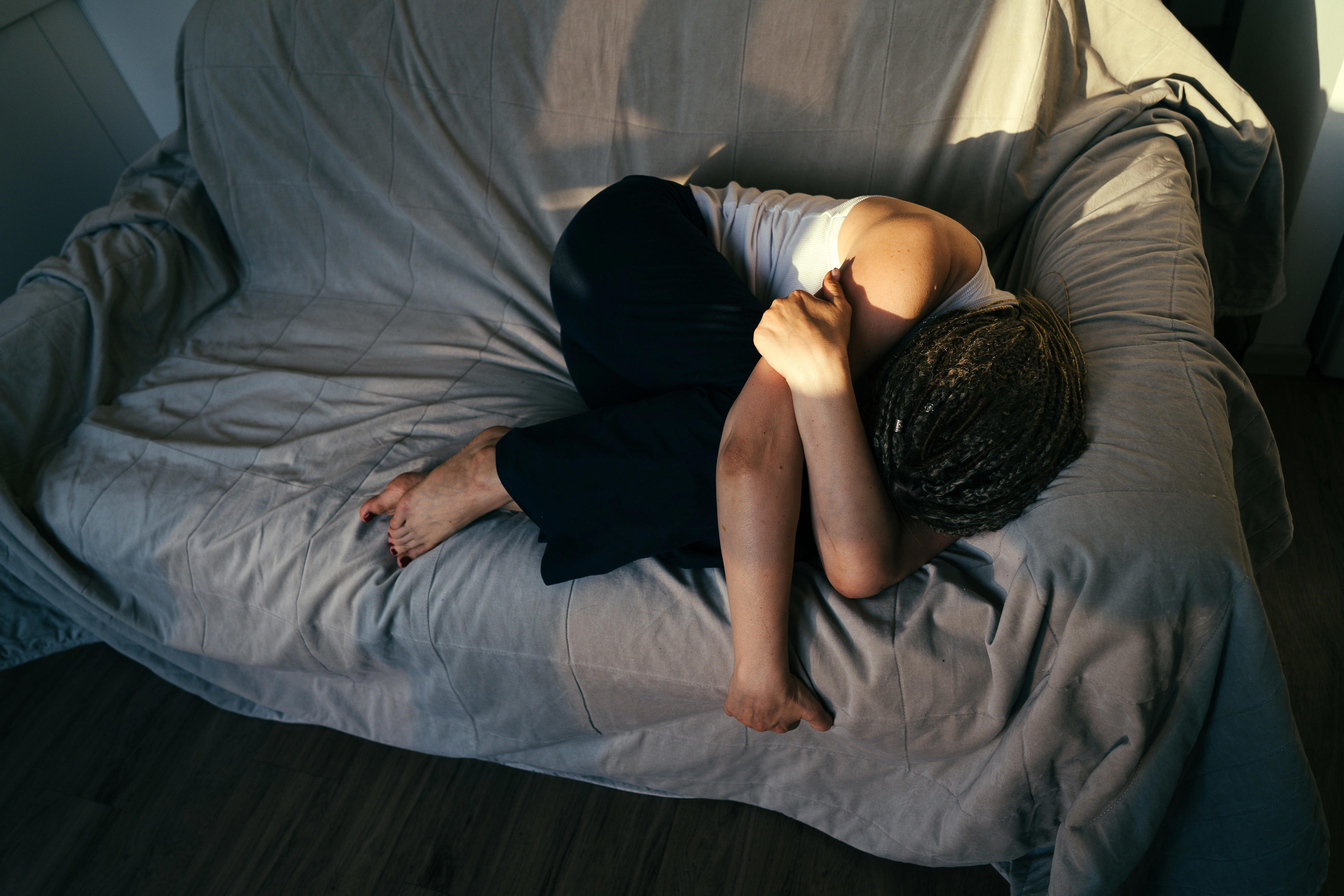 Woman on couch crying