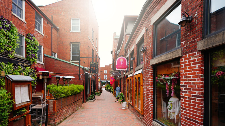 Historic downtown Portsmouth with brick shops on each side of the alley