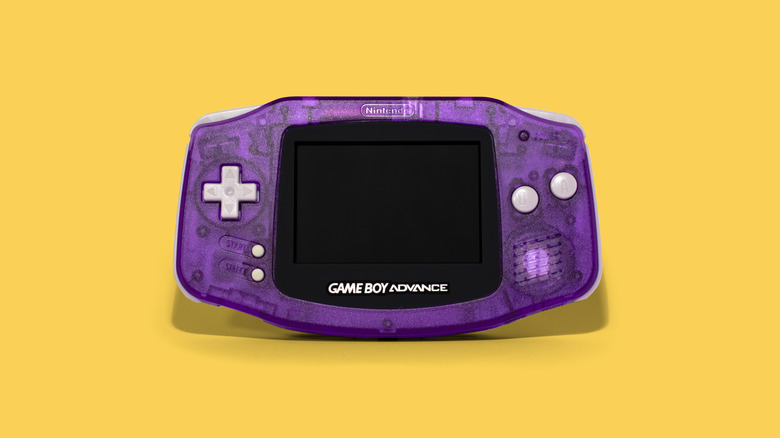 a purple Game Boy Advance over a yellow background