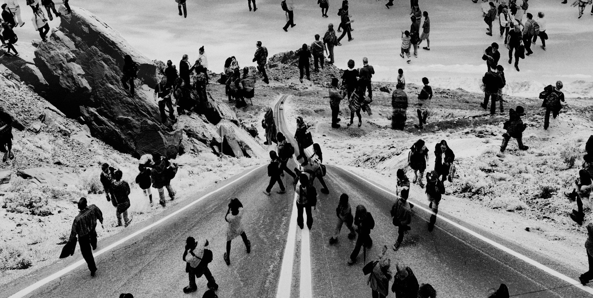 Shot of group of people superimposed over a road in the Valley of Fire, Arizona.