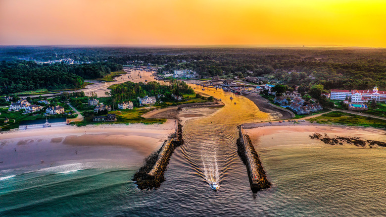 Kennebunkport, Maine inlet with the town on both sides and sunset in the background