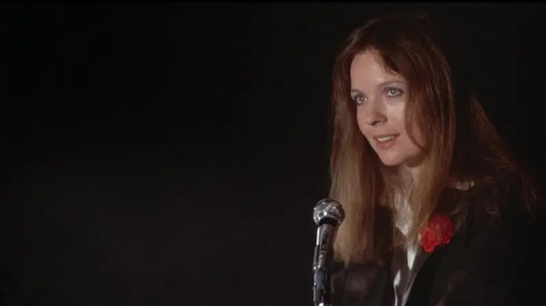 Annie Hall (Diane Keaton) approaches a microphone in Annie Hall