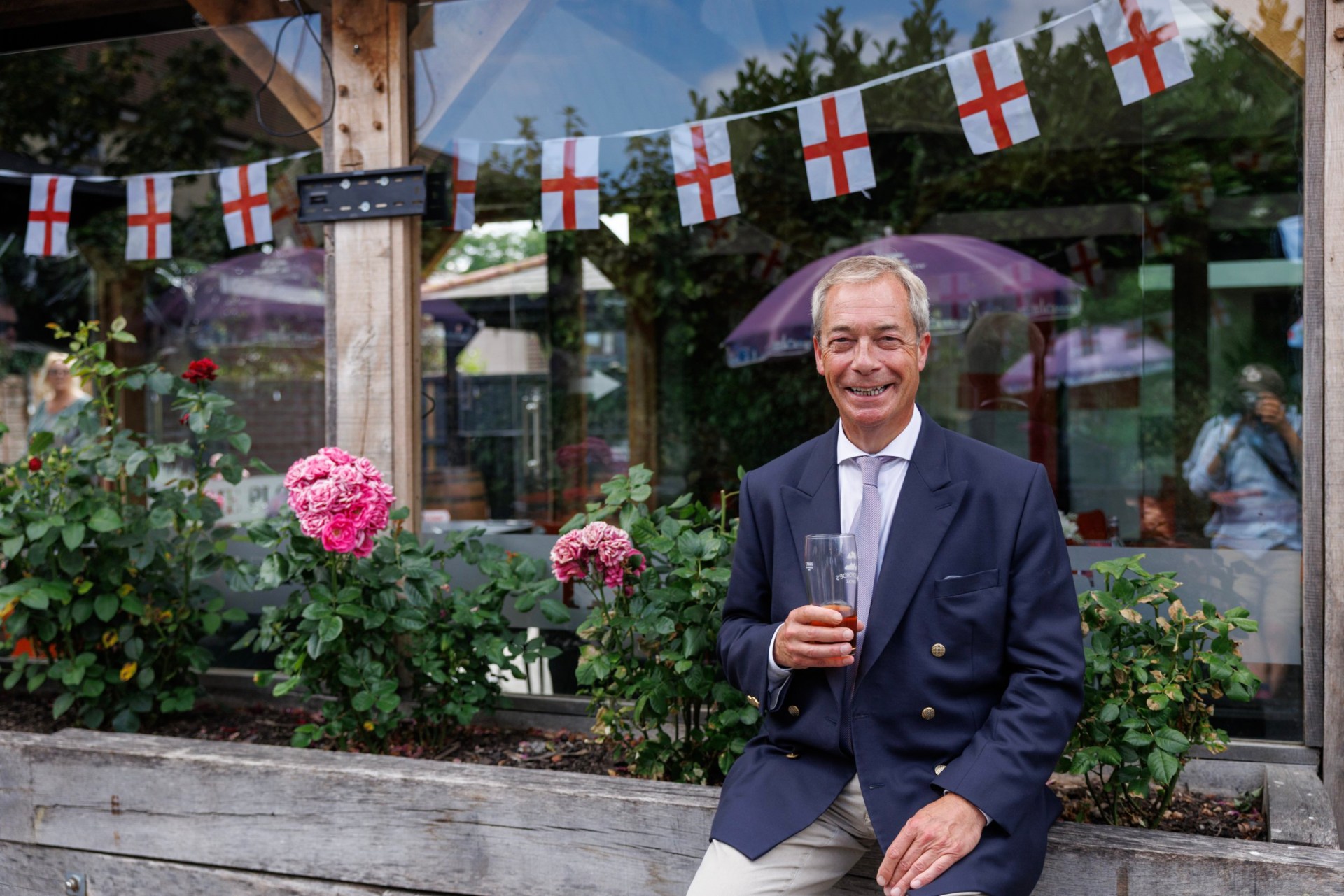 Reform UK leader Nigel Farage drinks a pint in a pub on July 08, 2026 in Great Bentley, England.