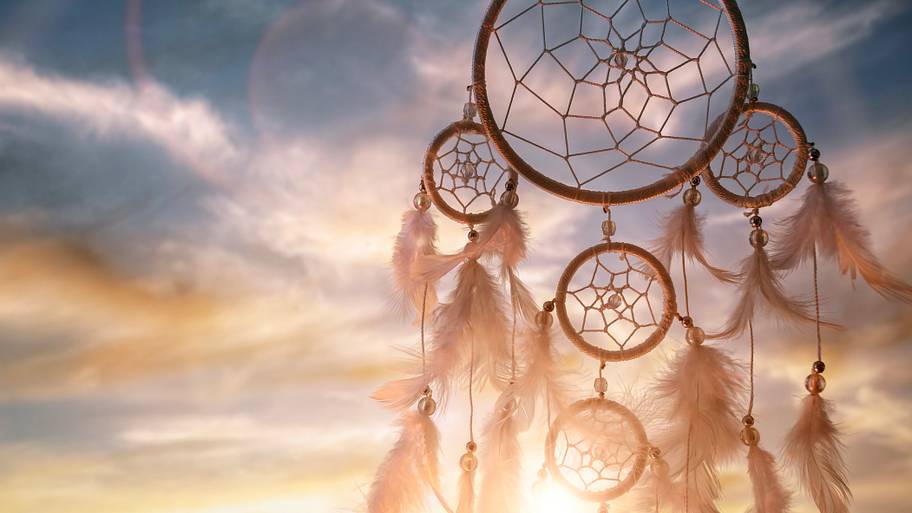Dream catcher at sunset background