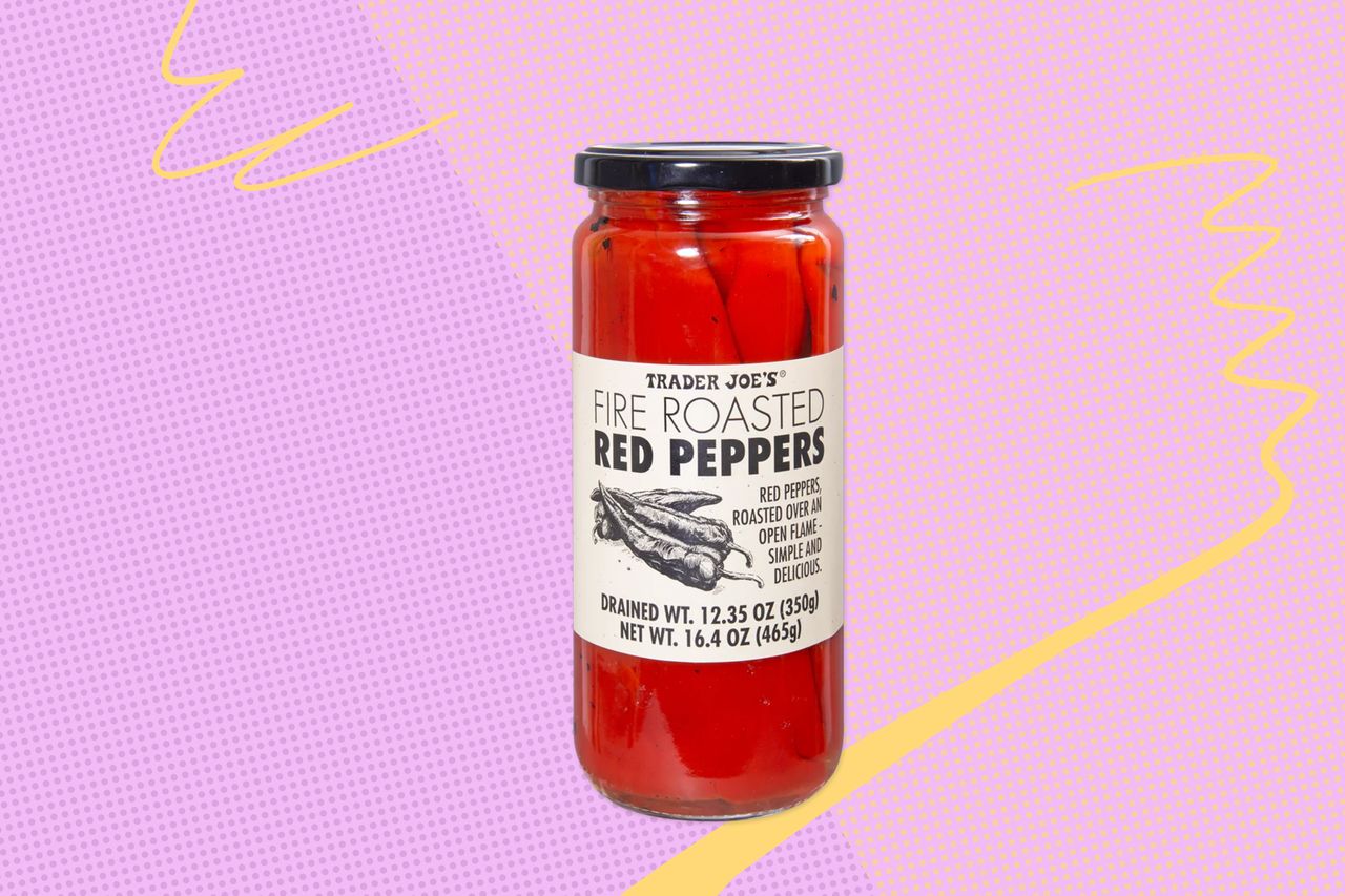 A jar of Trader Joes fire roasted red peppers against a colorful background