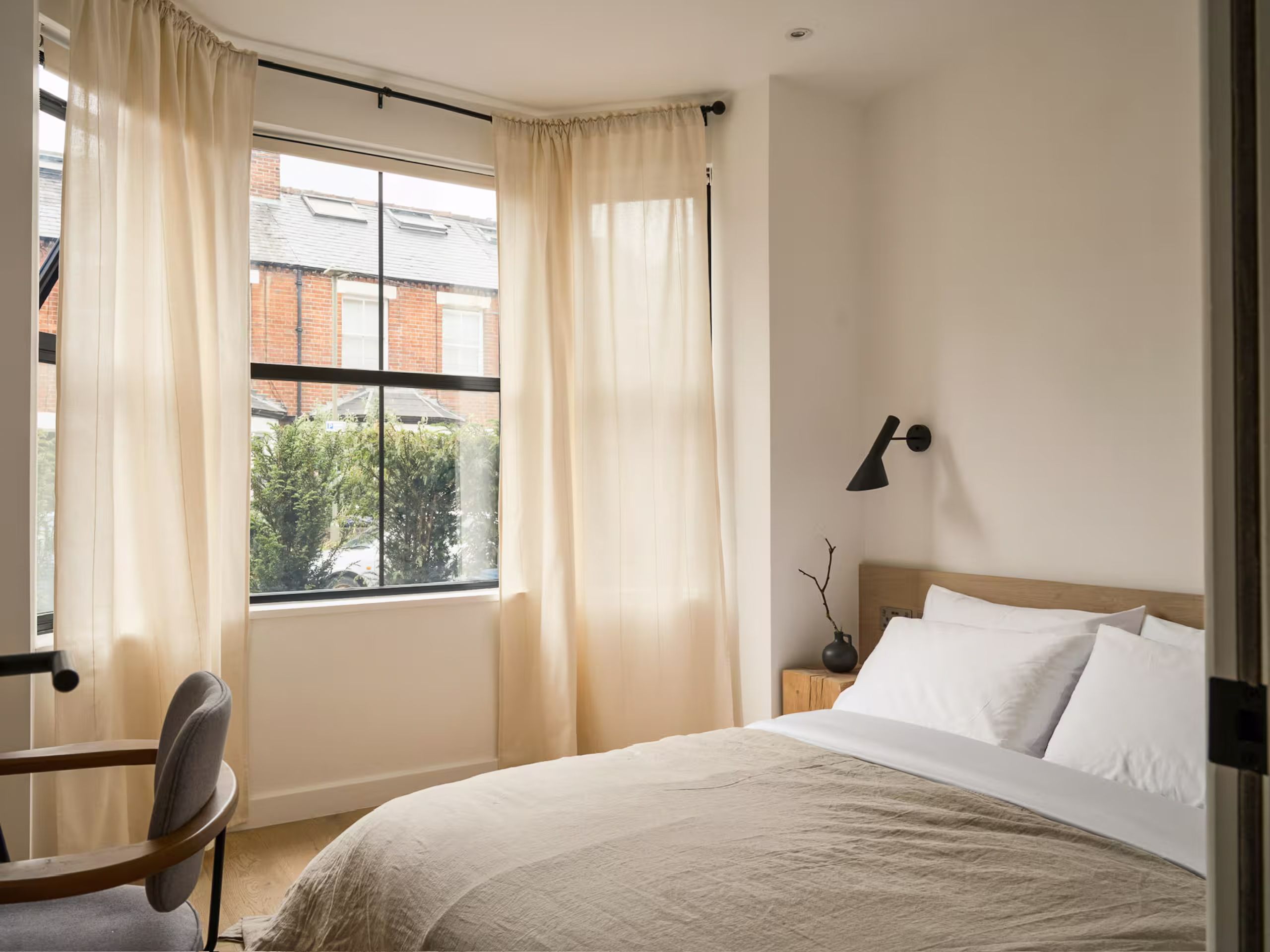 One of the bedrooms with a large window