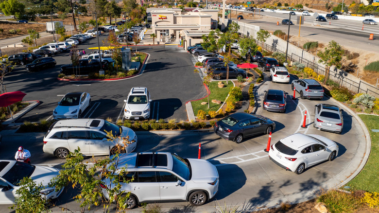A crowded drive-thru line with a lot of cars at In-N-Out Burger