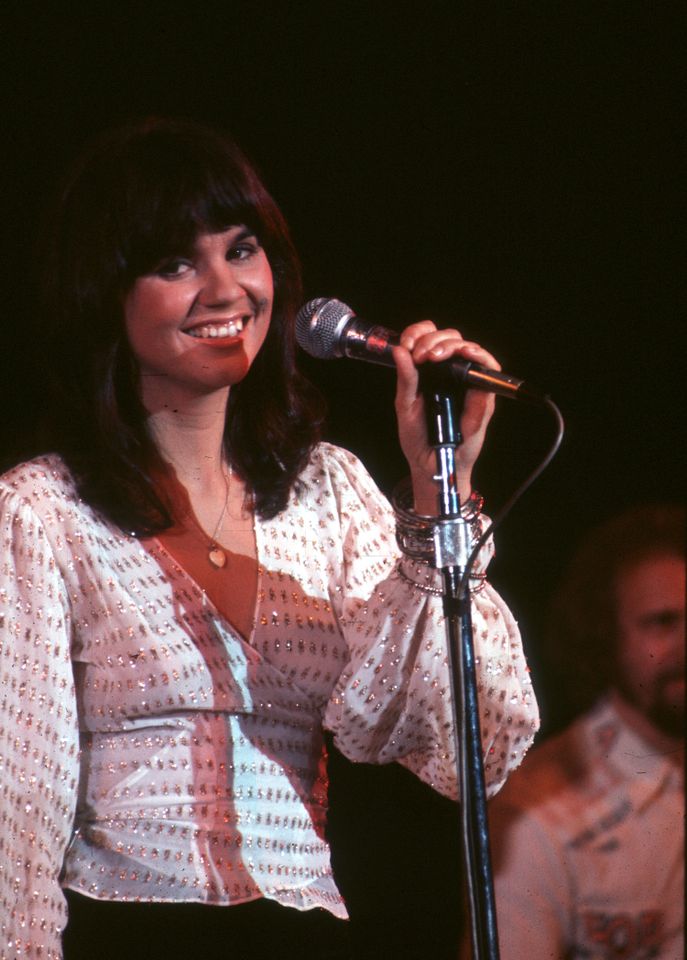 Linda Ronstadt performing on stage with a microphone