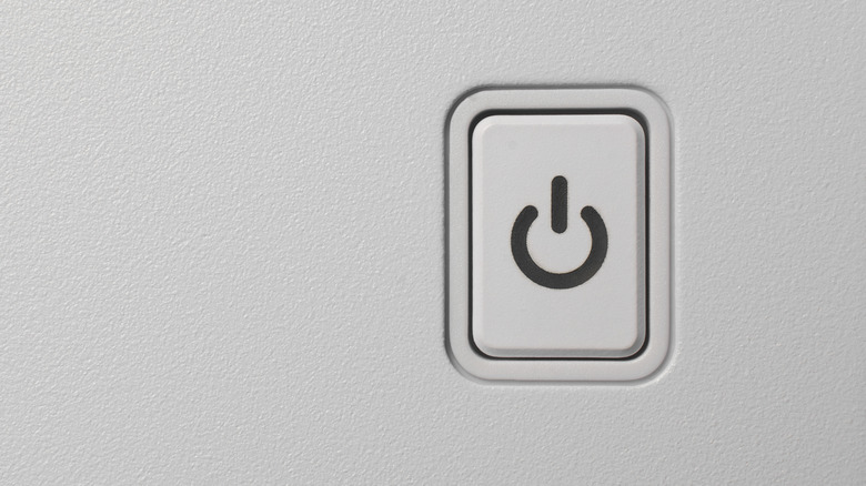 Close-up of a computer or electronic device's power button.