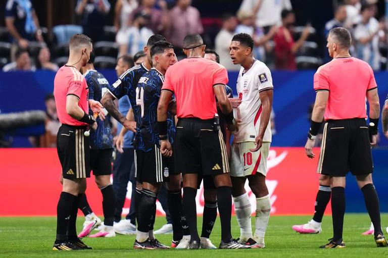 Argentina and England players argue over a yellow card