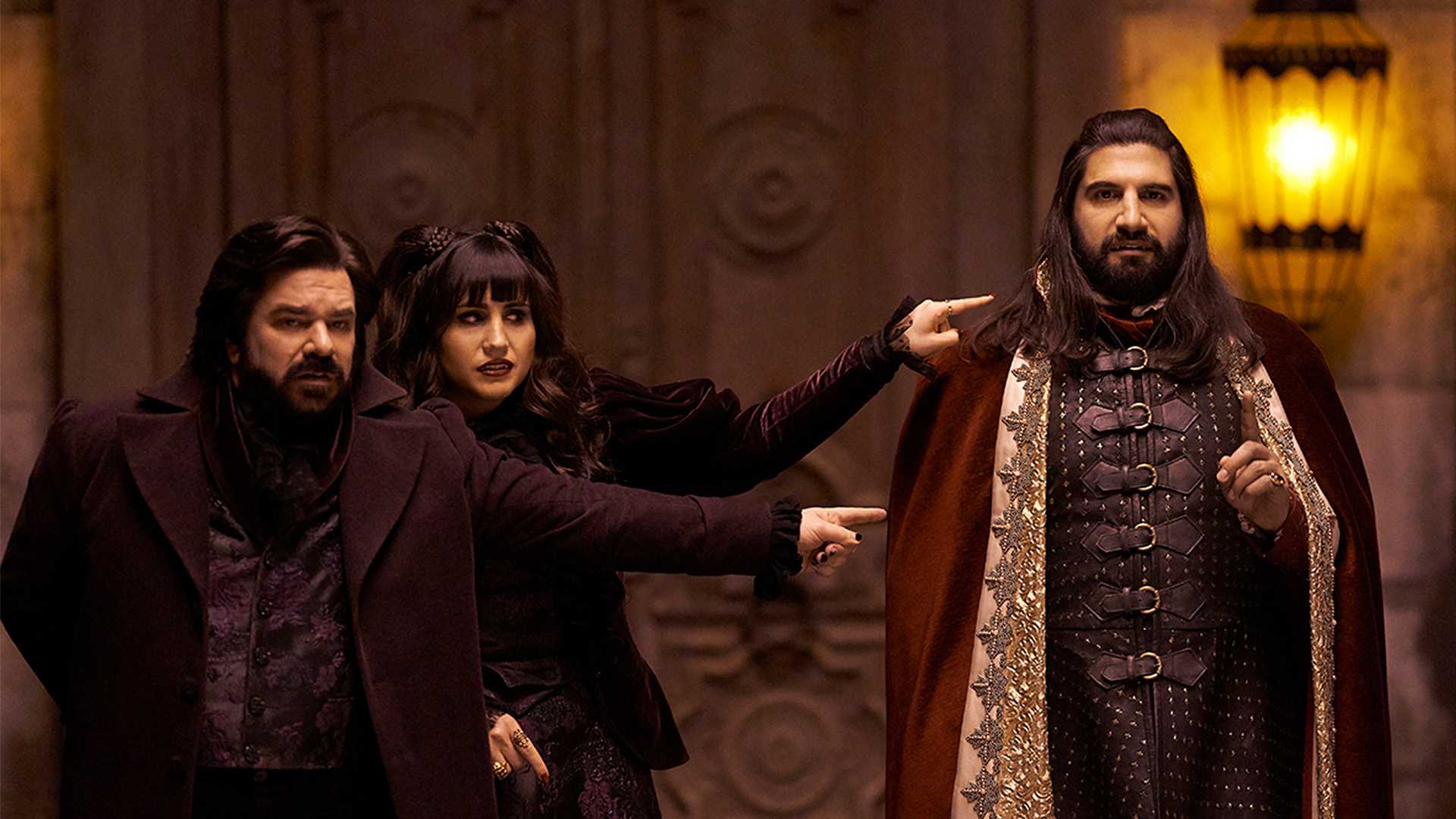 Laszlo and Nadja point at Nandor in What We Do In The Shadows.