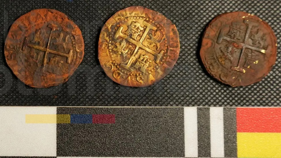 Three gold coins recovered from the San José.Colombian General Maritime Directorate/AFP/