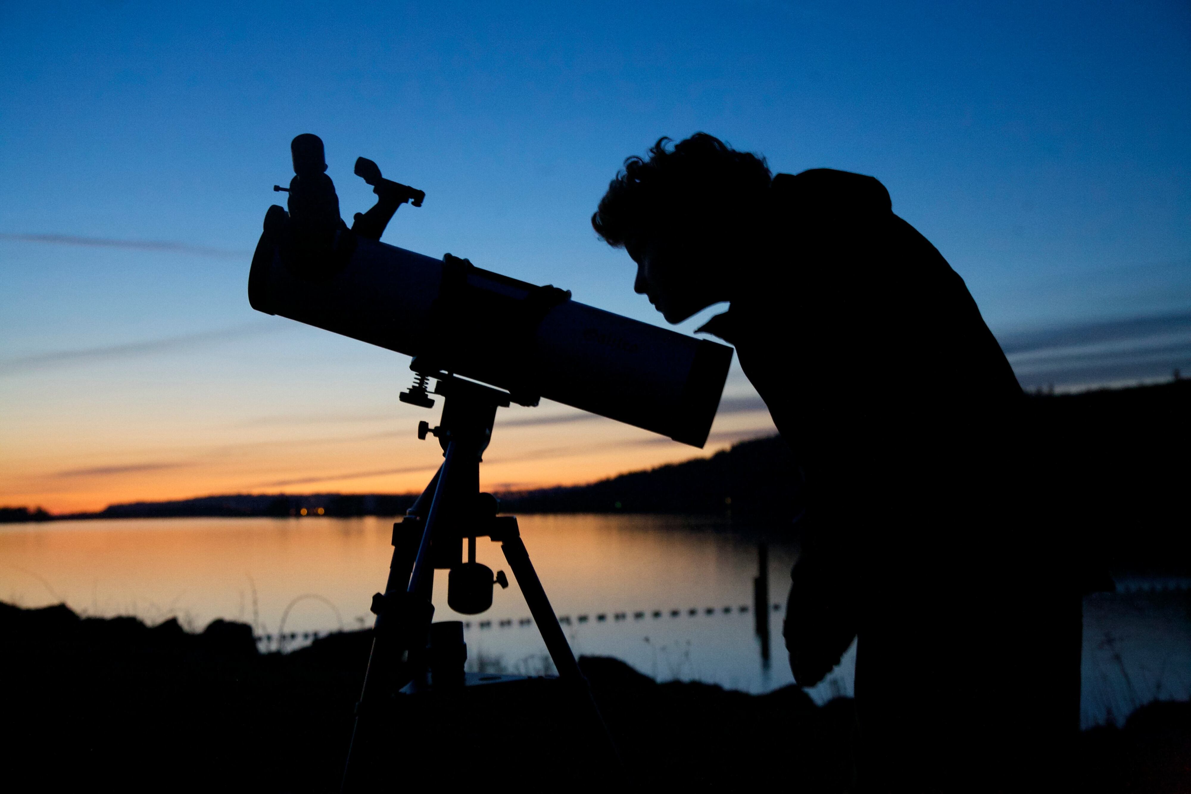 A young stargazer inspects his telescope during a star party at Rooster Rock State Park.