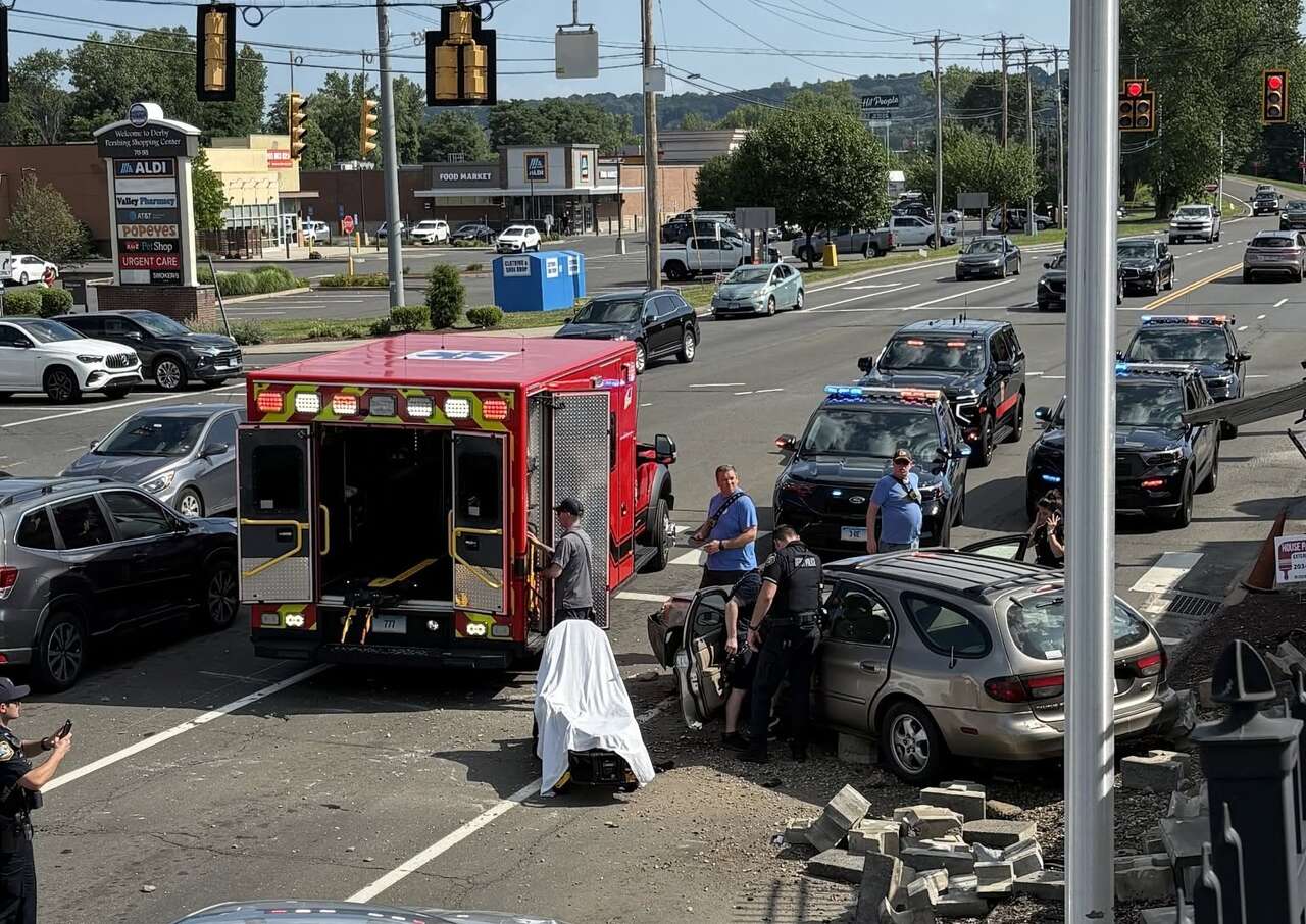 Derby driver hospitalized after crashing down retaining wall on ...