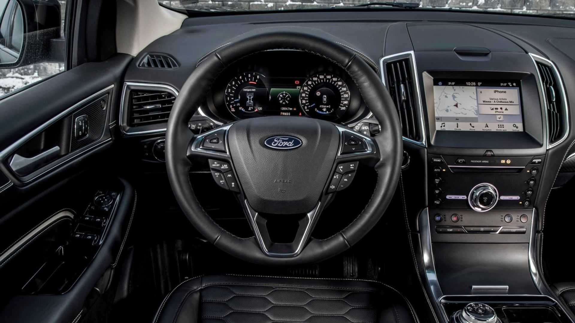Shot of the steering wheel and dashboard in a 2019 Ford Edge.