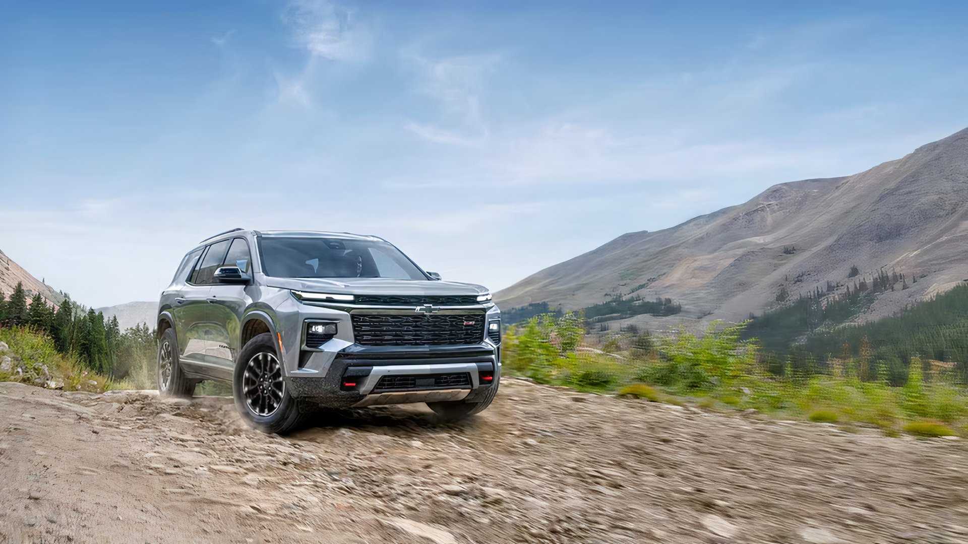 Front 3/4 action shot of 2026 Chevrolet Traverse driving off-road
