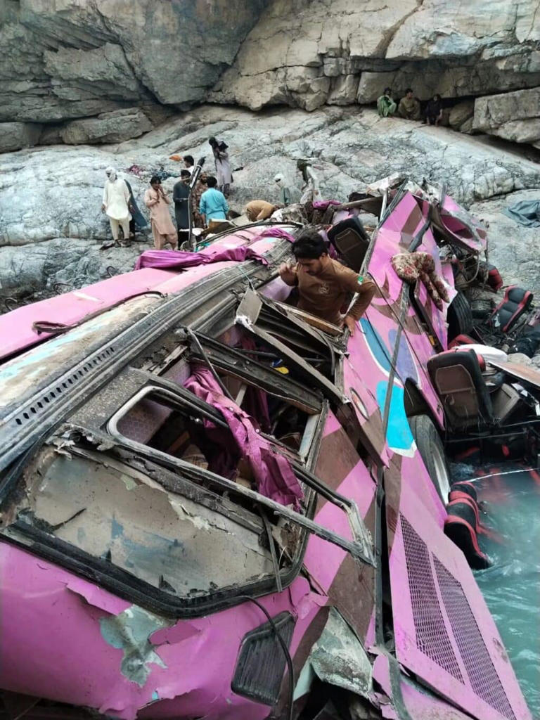 Pakistan bus crash: 40 dead as overcrowded bus falls into ravine