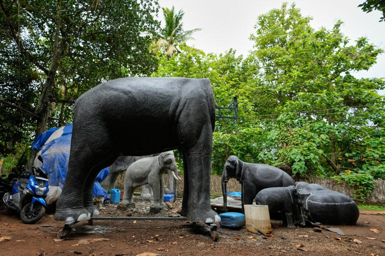 An unfinished robotic elephant stands alongside others at a backyard workshop in Chalakudy, in the southern Indian state of Kerala. Photo: AP