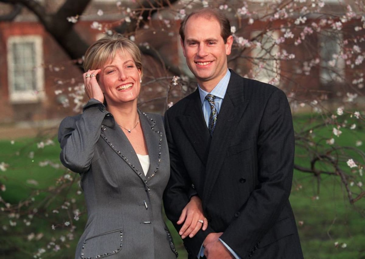 (L-R) Sophie Rhys-Jones and Britain's Prince Edward smile for photographers on grounds of St. James's Palace during announcement of their engagement. (Photo by Ken Goff/Getty Images)