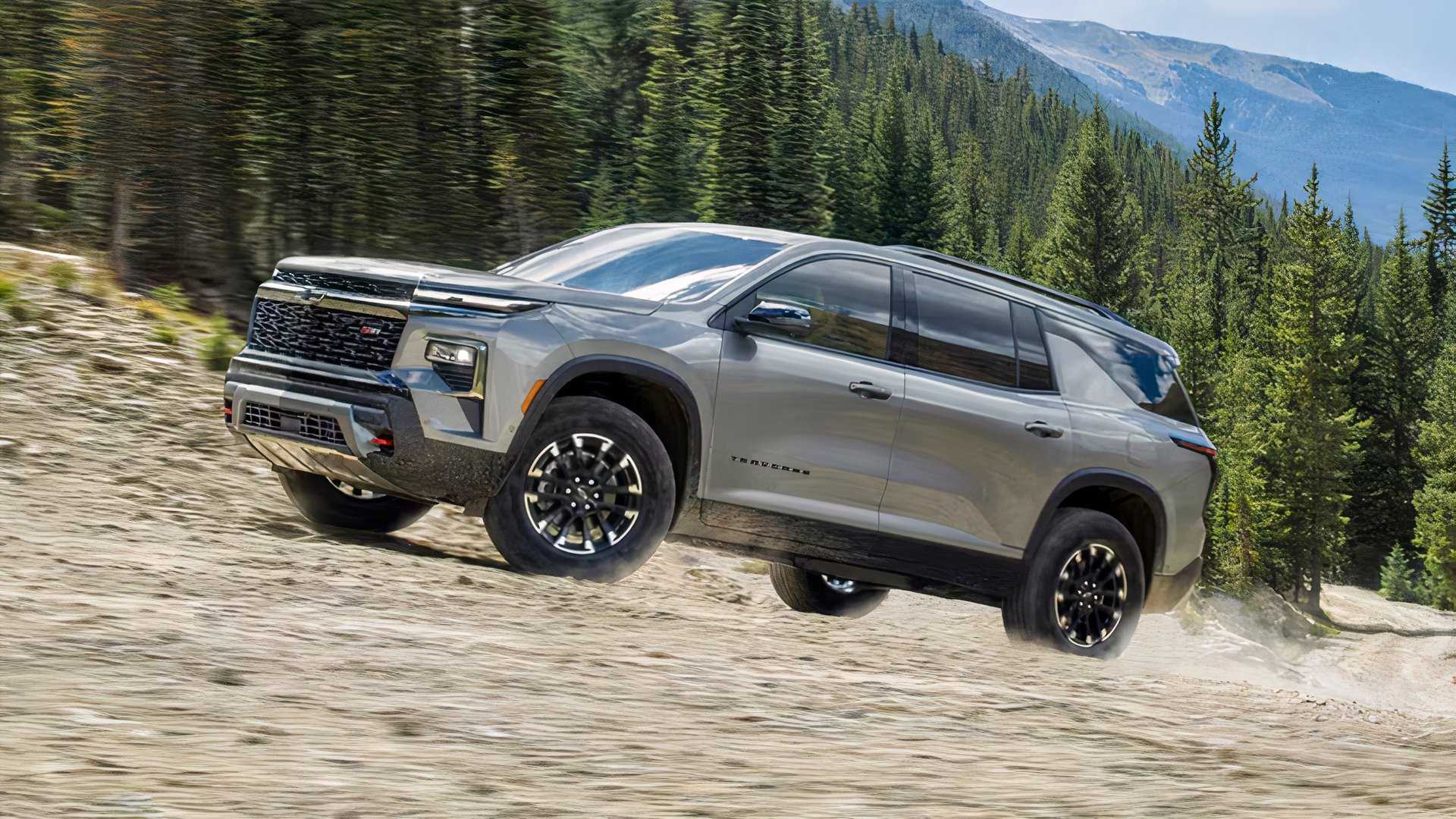 Front 3/4 action shot of 2026 Chevrolet Traverse driving off-road