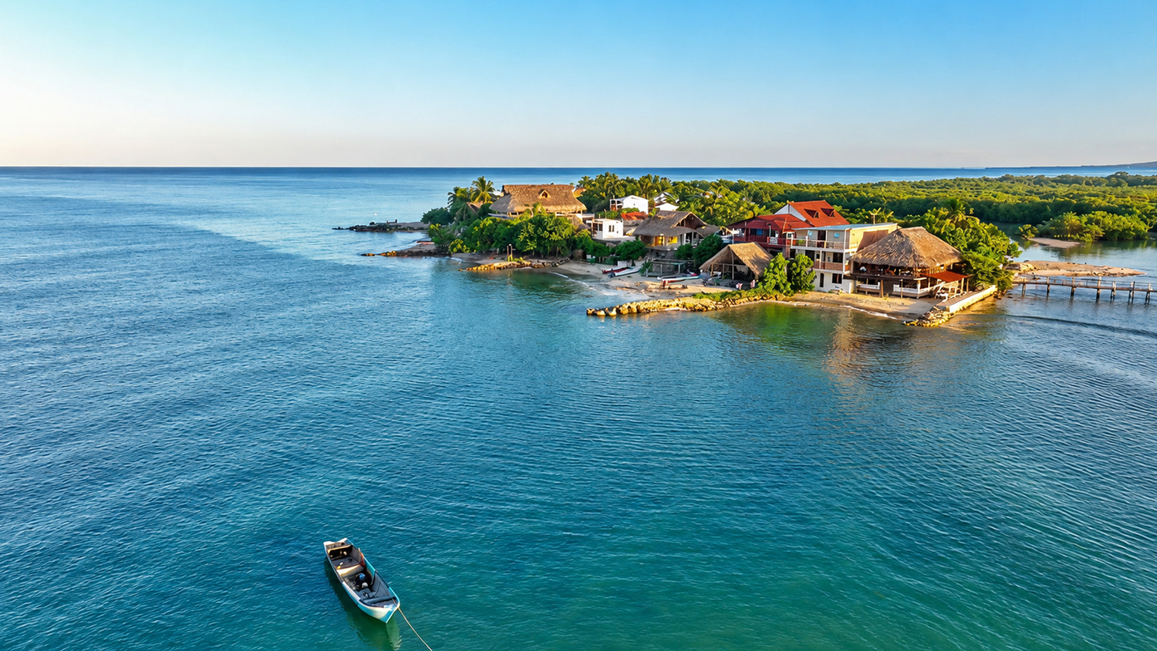 Rincon del Mar’s coastal houses beside calm blue Caribbean water