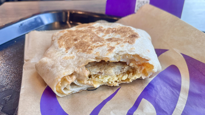 Breakfast Crunchwrap Sausage on a paper wrapper