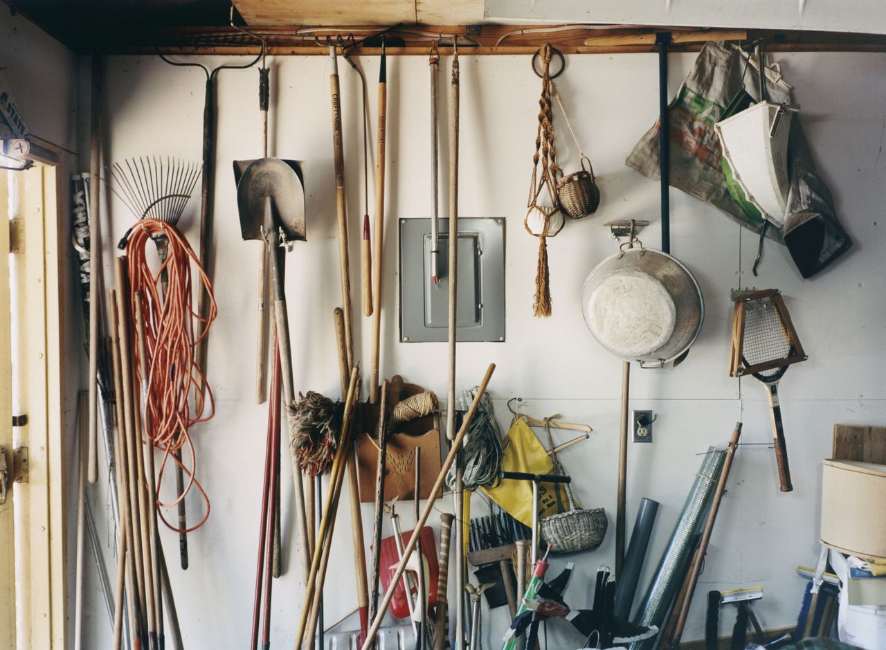 Gardening tools hanging in a garage