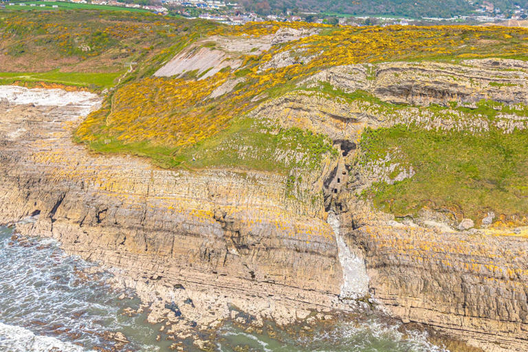 Pigeons or pirates? Mystery behind beach's secluded cave in the cliffs