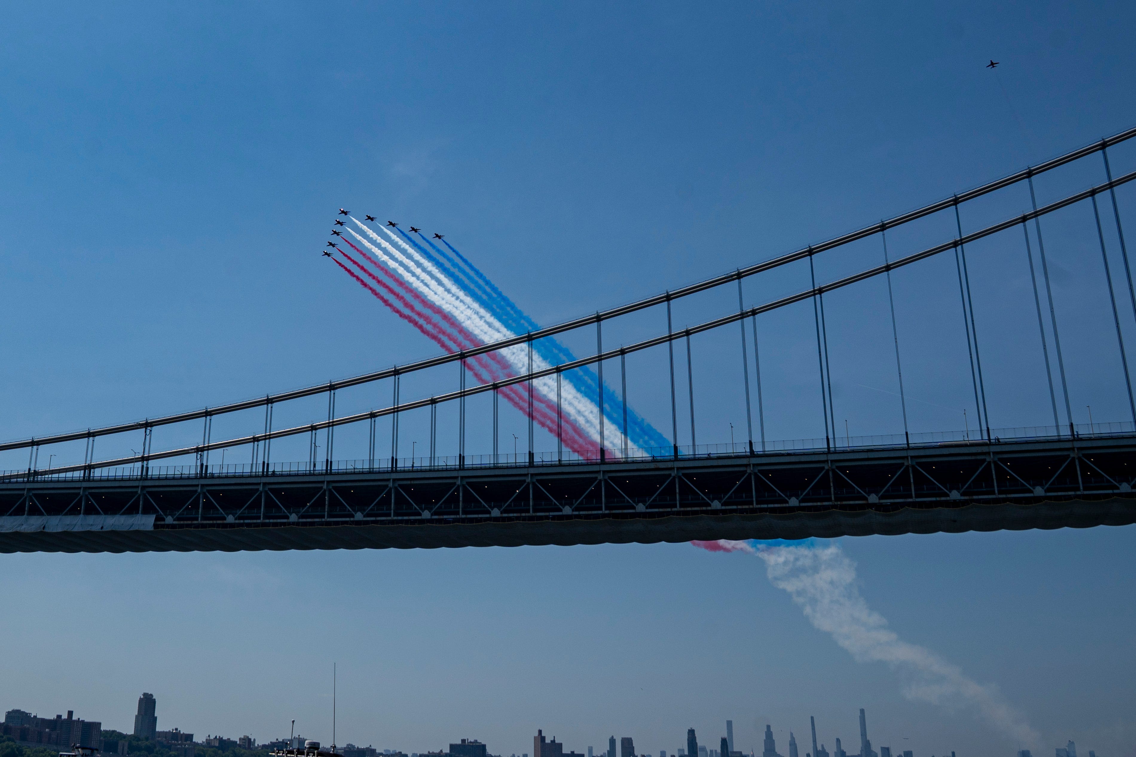 Military aircraft perform a flyover over the George Washington Bridge up the Hudson River on Jul 4, 2026 in Fort Lee, NJ, US.