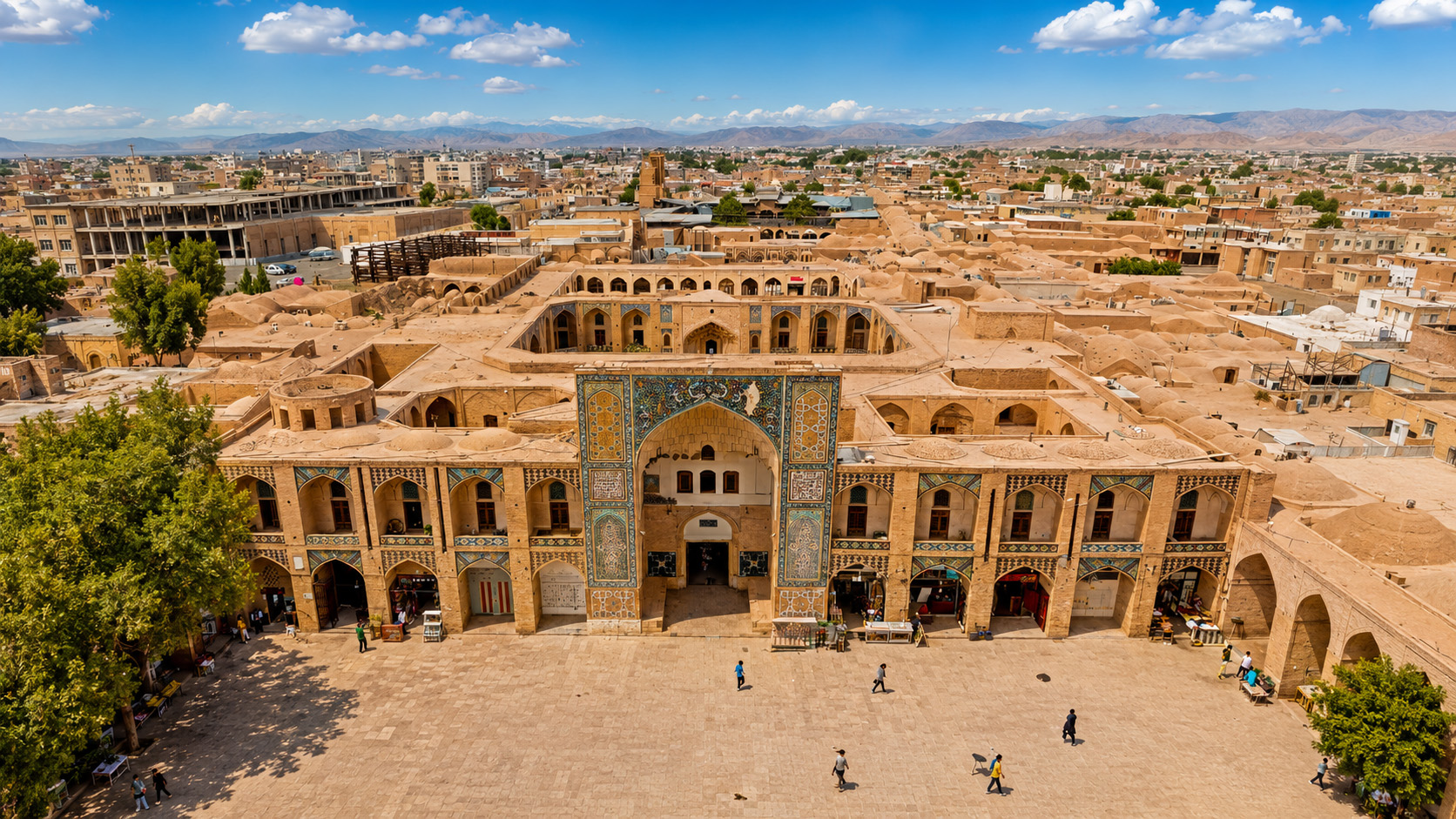 A historic Persian bazaar with arched courtyards and clay rooftops