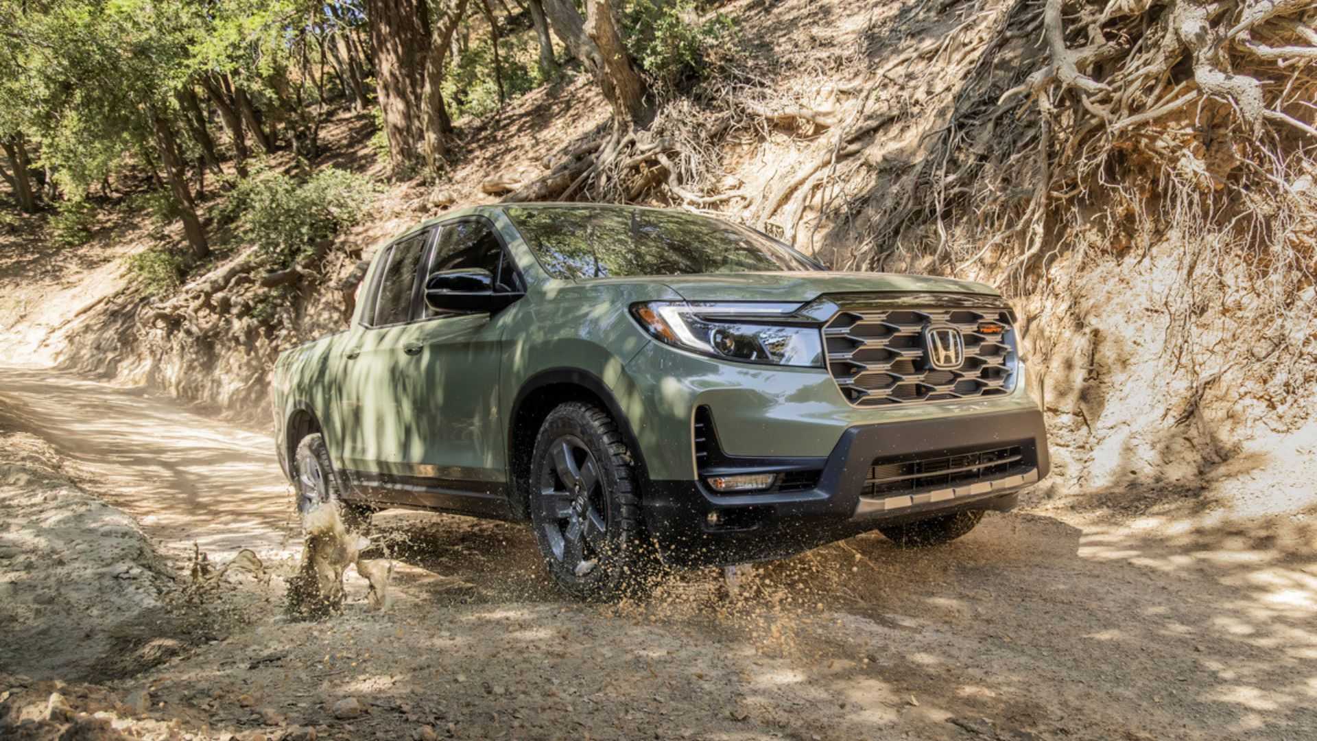 Dynamic front 3/4 shot of a green 2026 Honda Ridgeline TrailSport.