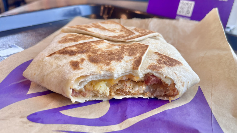 Bitten off portion of a Breakfast Crunchwrap Bacon