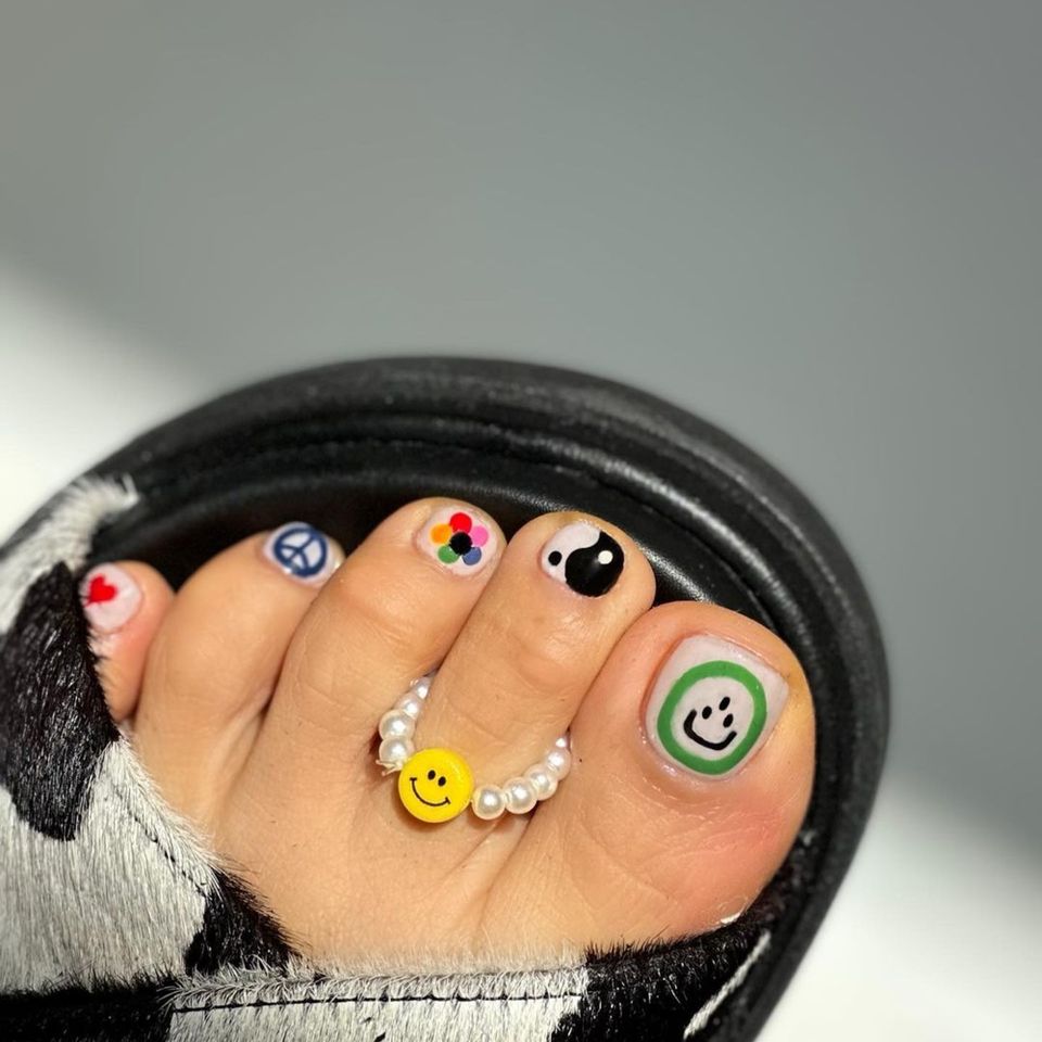 Artsy mix-n-match pedi with cute toe ring - InStyle Spring Pedicure Ideas